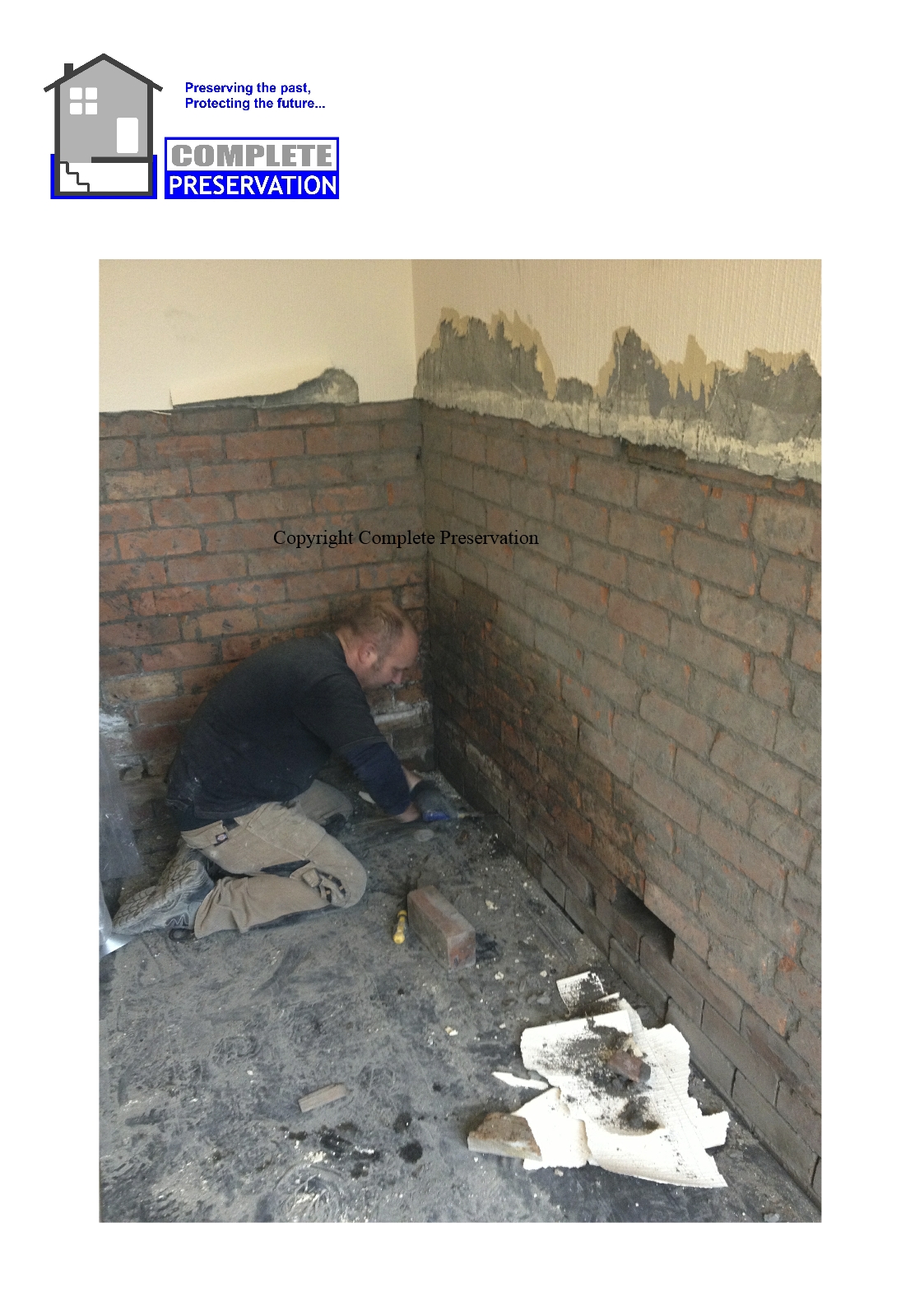 RISING DAMP ON A CAVITY WALL BEING CLEANED OUT