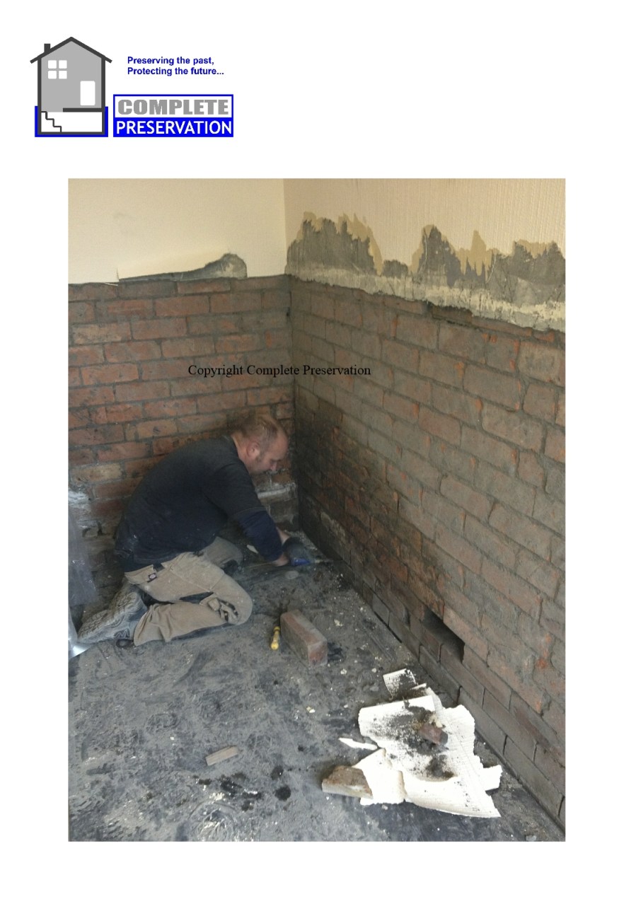 RISING DAMP ON A CAVITY WALL BEING CLEANED OUT